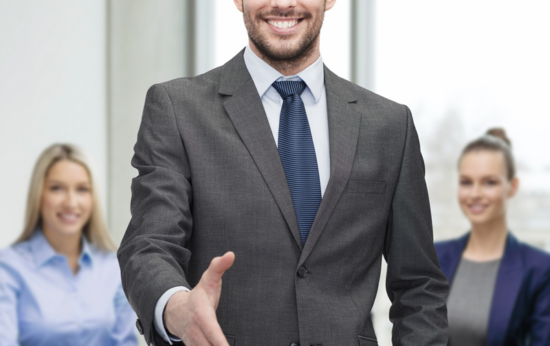 businessman with open hand ready for handshake